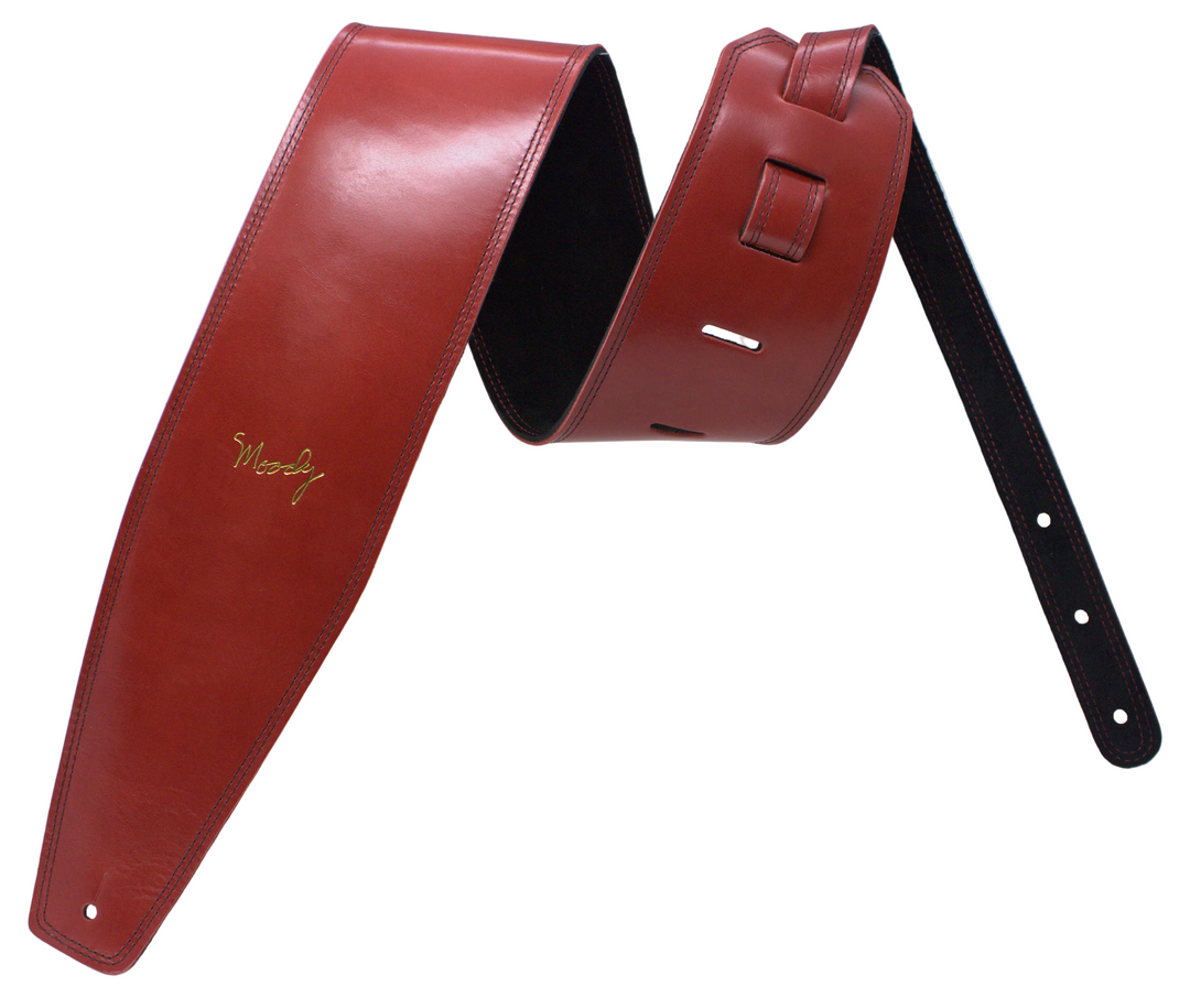 A red leather guitar strap with a black underside, featuring a gold script logo that reads 'Moody', displayed against a white background.